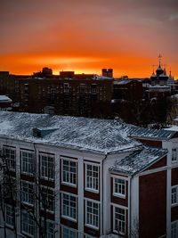 High angle view of buildings against sky during sunset