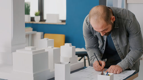 Midsection of man working at office