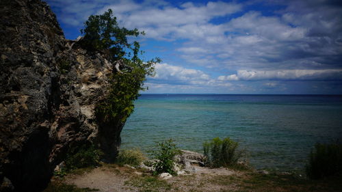 Scenic view of sea against cloudy sky