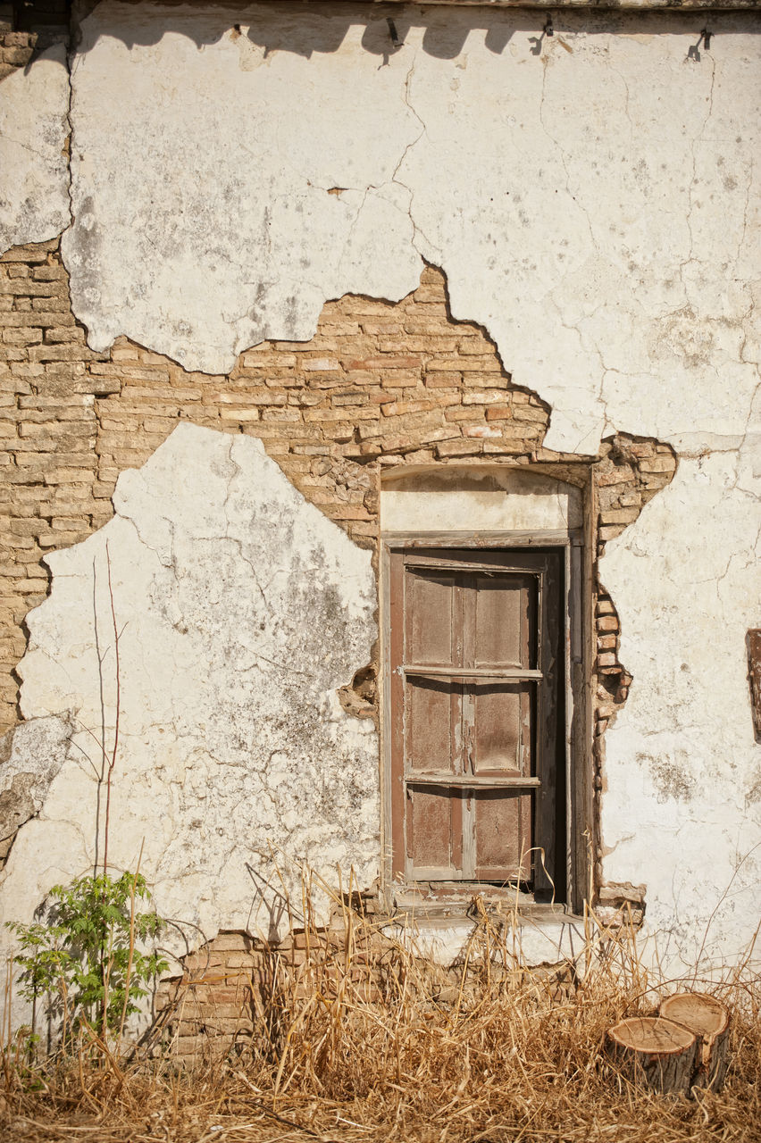 WEATHERED WALL OF OLD HOUSE