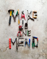 Make do and mend,high angle view of words made with hand tools