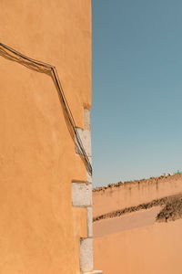 High section of built structure against clear sky