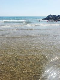 Scenic view of beach against clear sky