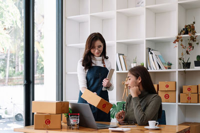 Portrait of young woman working at home