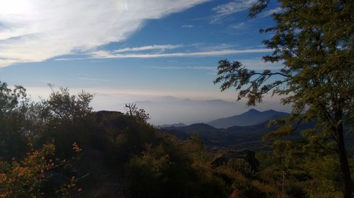 Scenic view of landscape against cloudy sky