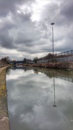 Reflection of sky on puddle in winter