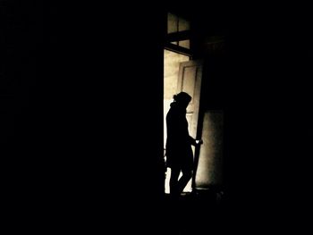 Woman in dark room