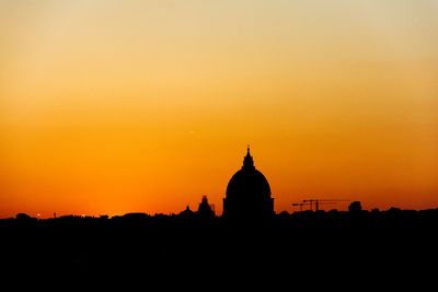 Silhouette church against sky during sunset