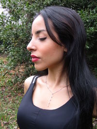 Portrait of beautiful young woman looking away