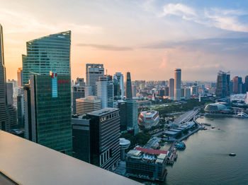 High angle view of cityscape against cloudy sky