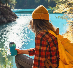 Rear view of woman using mobile phone
