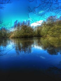 Scenic view of lake against blue sky