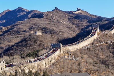 Panoramic view of a building with mountain range in the background