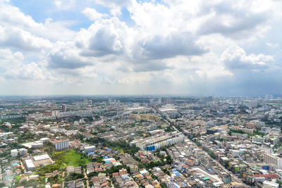 High angle view of city buildings against sky