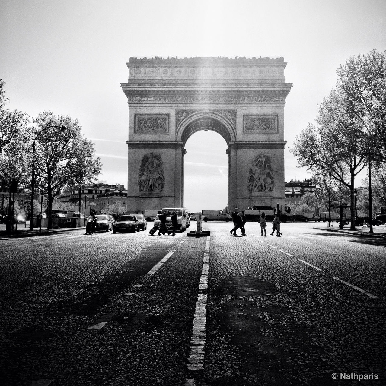 architecture, built structure, building exterior, tree, the way forward, arch, road, clear sky, street, transportation, history, city, incidental people, travel destinations, sky, famous place, travel, diminishing perspective, day