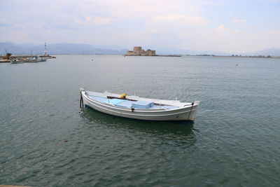 Nautical vessel on sea against sky