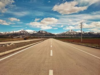 Road against cloudy sky