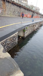 People on bridge over canal