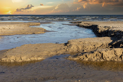 Scenic view of beach during sunset