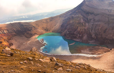 Green lake in the mouth of gorely volcano in kamchatka
