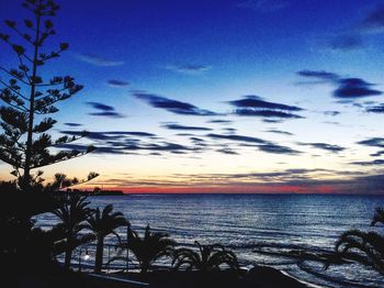 Scenic view of sea against sky at sunset