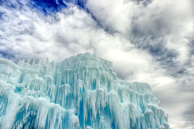 Low angle view of ice against sky