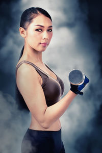 Portrait of woman standing outdoors