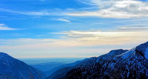 Scenic view of mountains against sky during winter