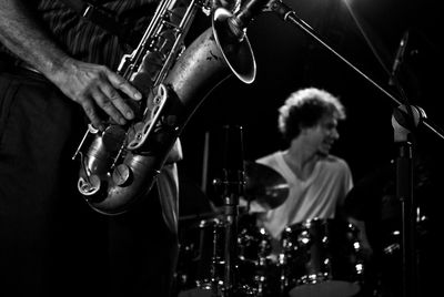 Low angle view of men playing guitar