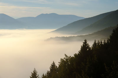 Scenic view of silhouette mountains against sky during sunset