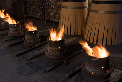 Fire burning amidst barrels