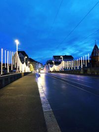 View of illuminated street at night