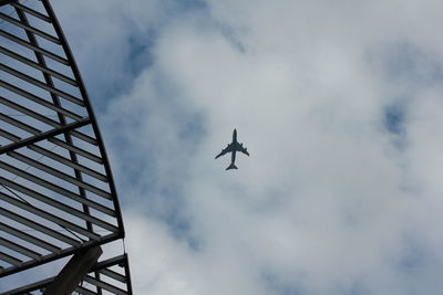 Low angle view of airplane flying in sky