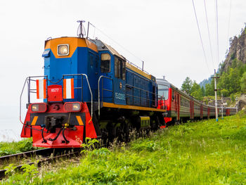 Train on railroad track against sky