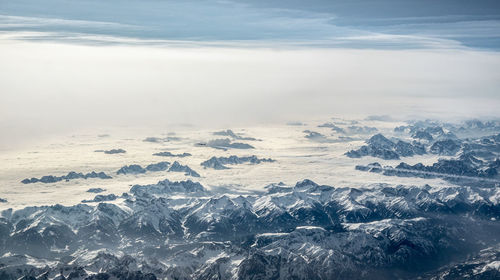 Scenic view of snowcapped mountains against sky