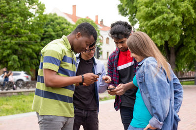 Young couple holding smart phone