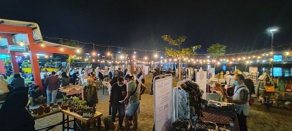 Group of people at market in city at night