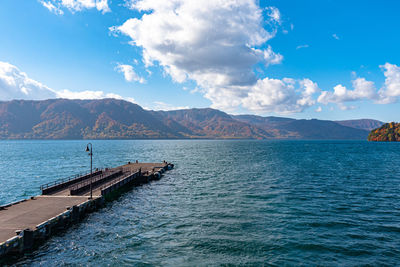  lake towada lakeside pier in autumn. towada hachimantai national park, aomori prefecture, japan