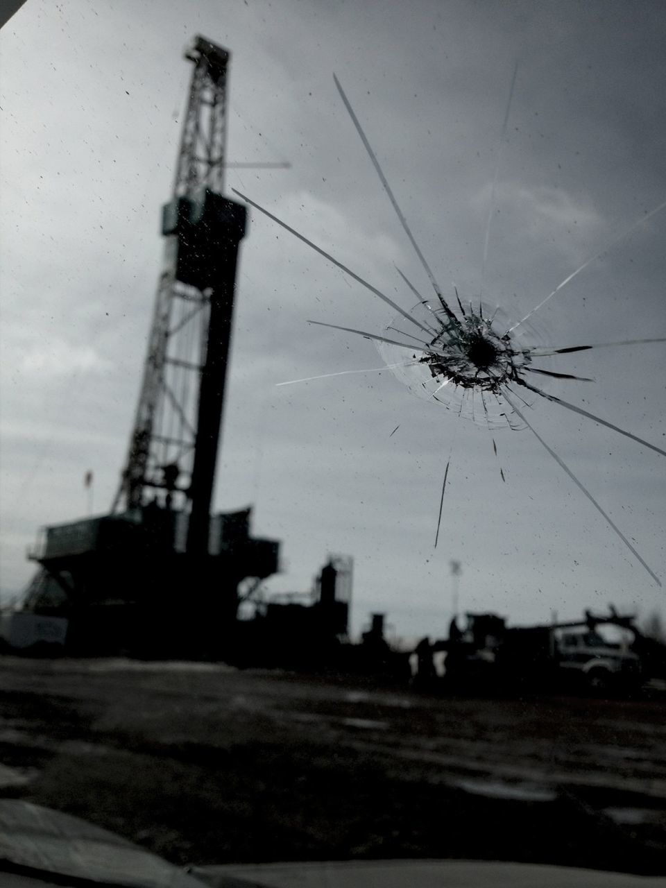 sky, low angle view, fuel and power generation, technology, built structure, building exterior, architecture, crane - construction machinery, electricity, no people, outdoors, dusk, cloud - sky, silhouette, electricity pylon, day, industry, tall - high, windmill, environmental conservation