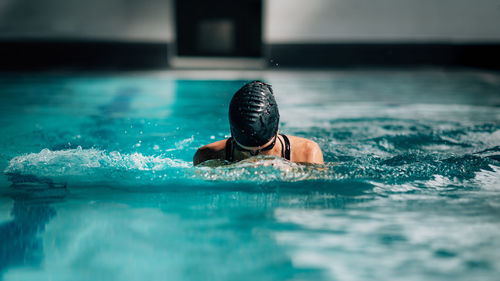 Man swimming in pool