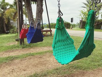 Clothes drying on grass against trees