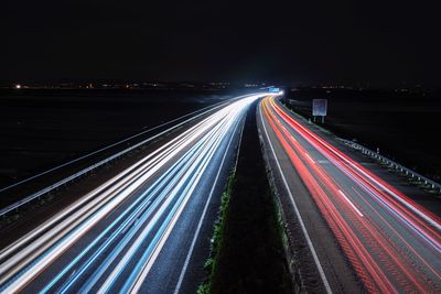 High angle view of light trails on road in city