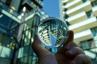 Cropped hand holding crystal ball