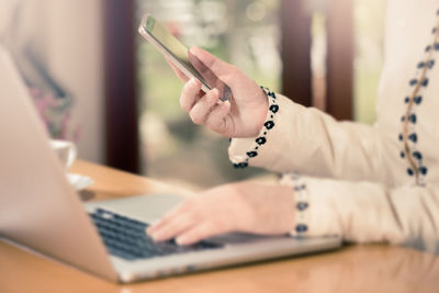 Close-up of hand using mobile phone