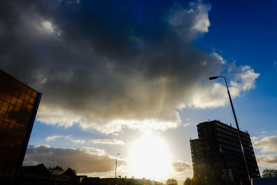 Low angle view of buildings against sky during sunset