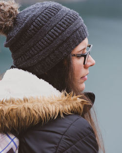 Close-up portrait of young woman wearing hat