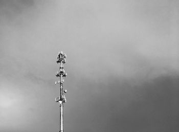 Low angle view of floodlight against sky