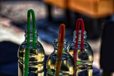 Close-up of wine bottles on table