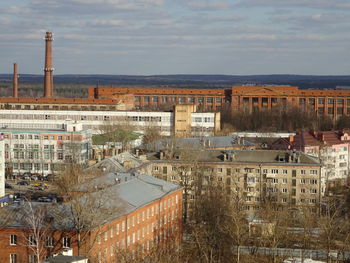 High angle view of buildings in city against sky