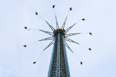 Low angle view of ferris wheel against sky